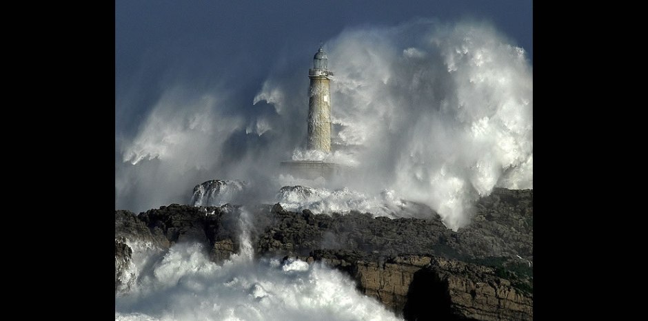 Mouro Lighthouse, Spain is built on a solid rock. These ferocious waves exceed the height of 37.5 meters (123 feet)! 